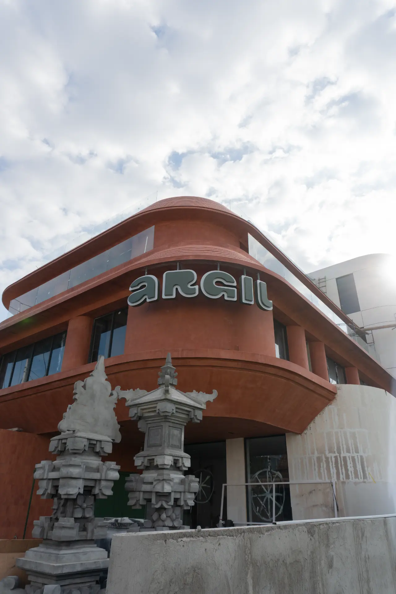 The entrance to Argil on Jl. Munduk Kedungu in Pererenan, Bali, with the signed doorway and scooter parking out front
